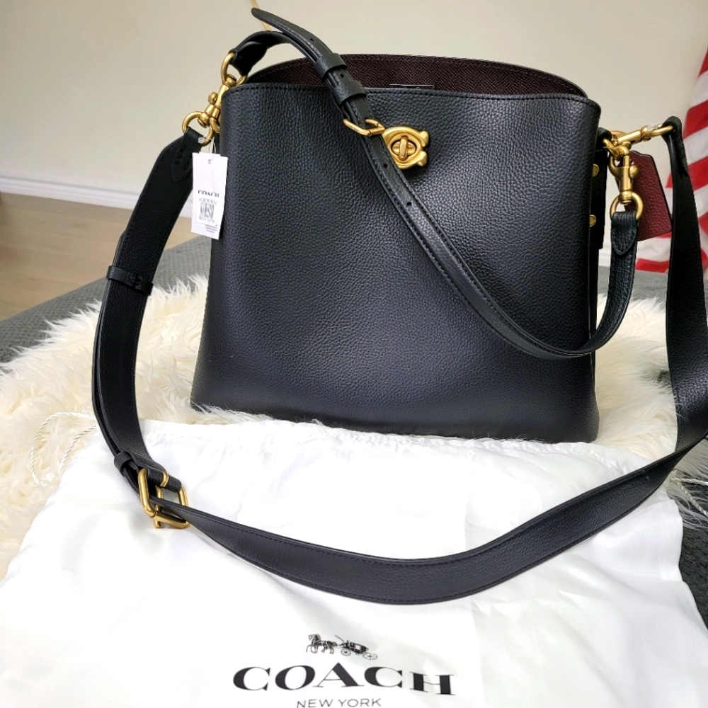 Authentic Coach black leather purse/crossbody.